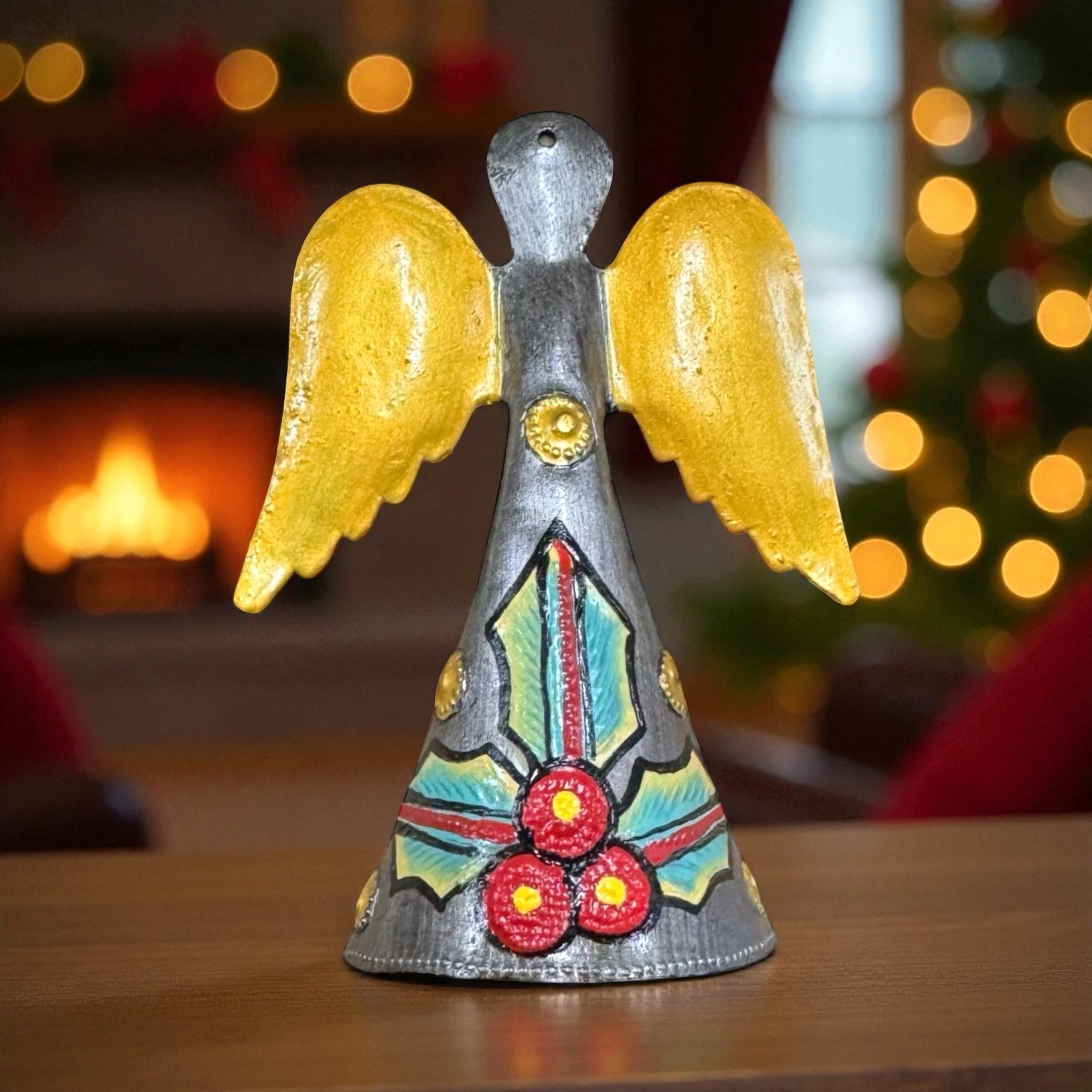 Decorative angel figurine with yellow wings on a white background