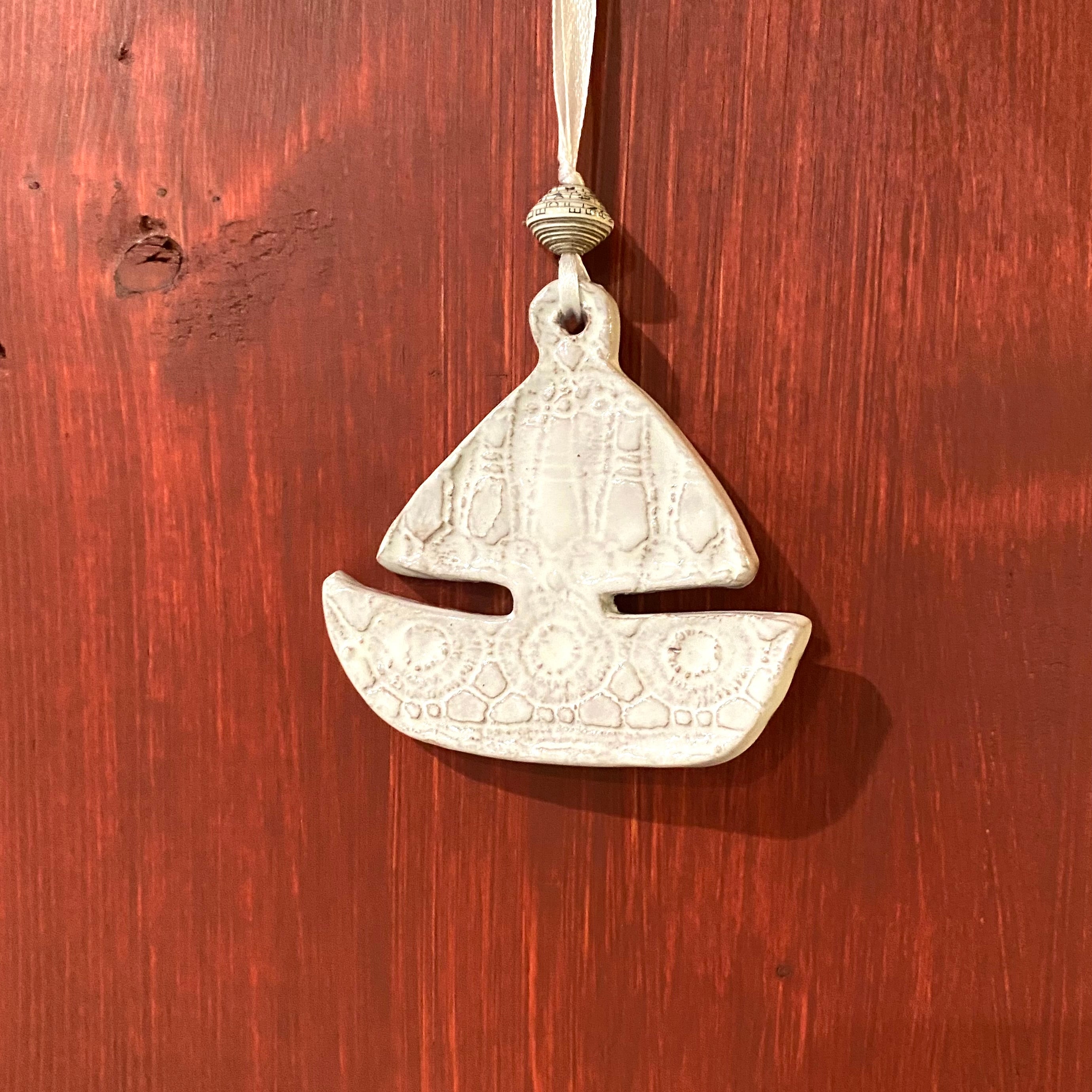Handmade sailboat ceramic ornament Haiti fair trade — white lace coastal holiday decor